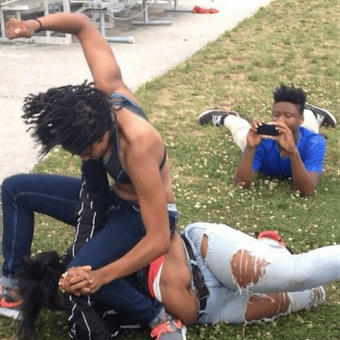 Guy recording a fight