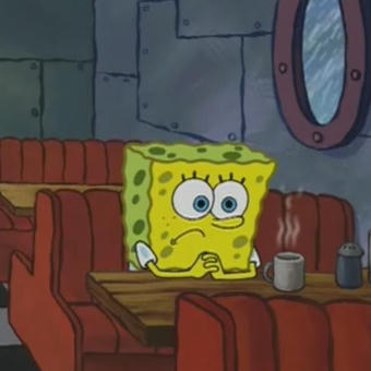 Spongebob sitting alone in diner